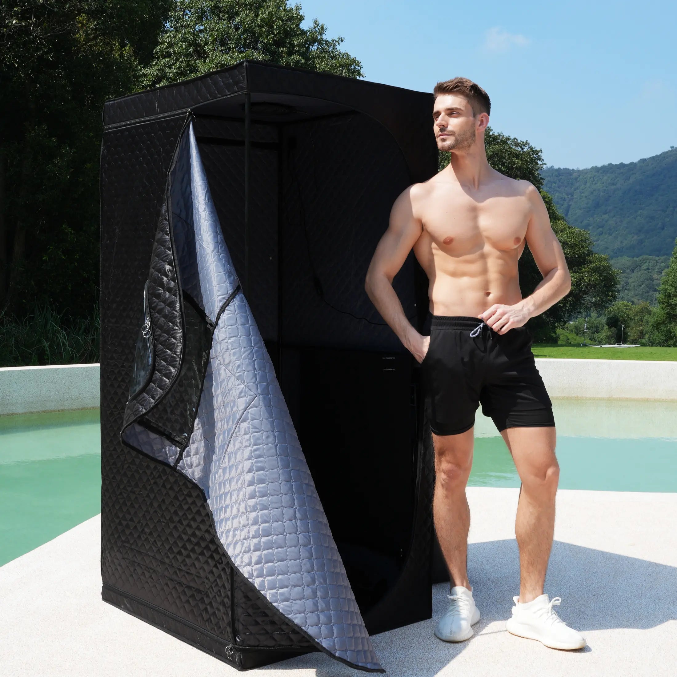 A man stands in a lucears steam sauna he built himself